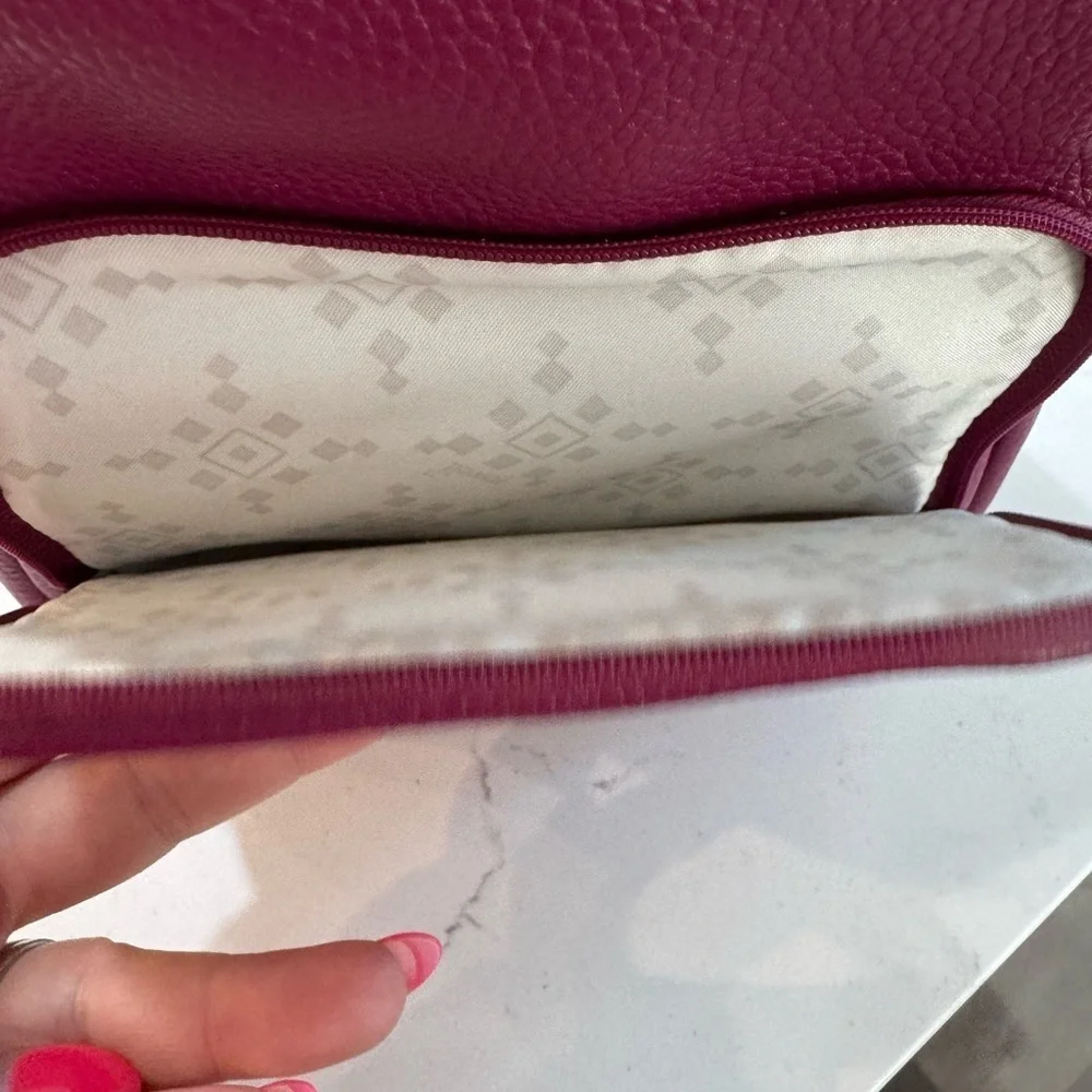 Jewell small backpack purse.  Purple in color. Good used condition.